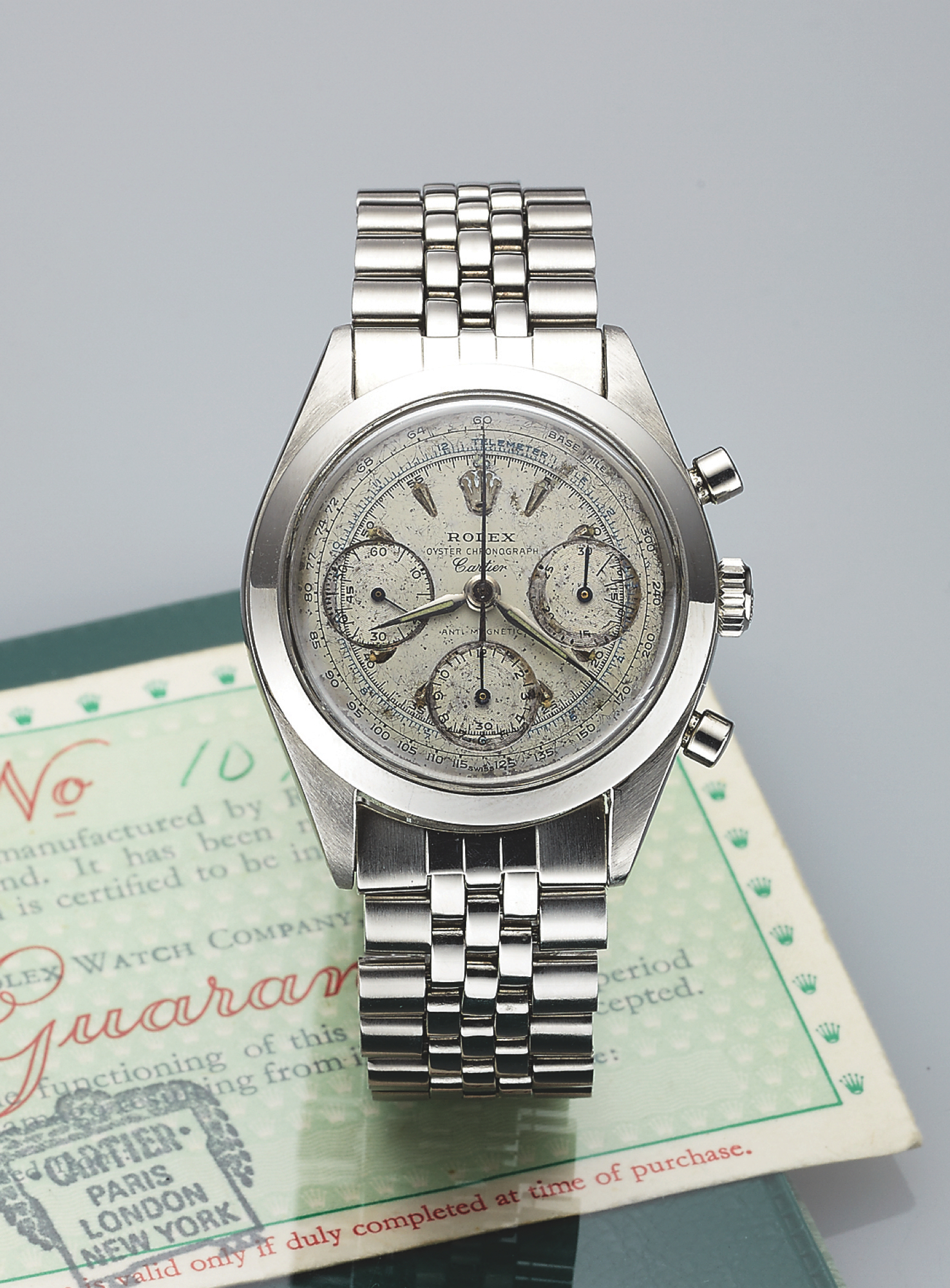 ROLEX REF. 6238 PRE-DAYTONA RETAILED BY CARTIER Rolex Chronograph, case No.  1077746, Ref. 6238/6241. Retailed by Cartier. Made circa 1964. Fine and  very rare, stainless steel wristwatch with round button chronograph,  registers,