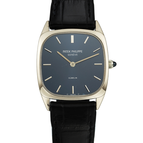 PATEK PHILIPPE REF. 3566, RETAILED BY GÜBELIN, WHITE GOLD Patek Philippe,  Genève, No. 1174435, case No. 2726260, Ref. 3566. Made circa 1975. Fine and  elegant, cushion shaped, thin, 18K white gold wristwatch